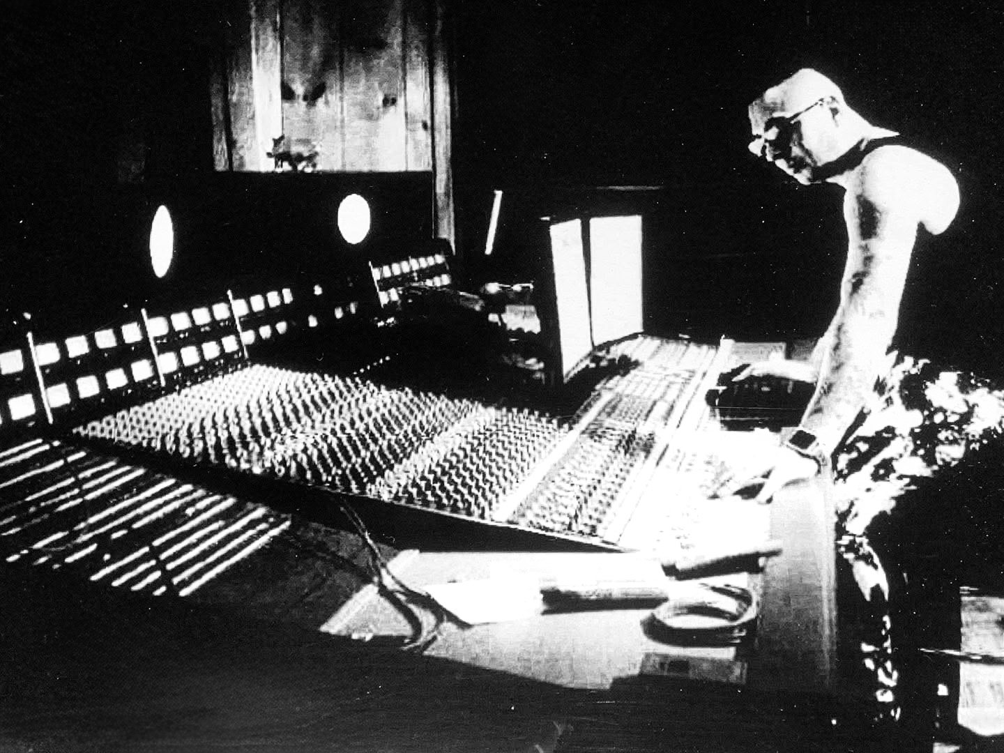 René De La Muerte at a large-format mixing console
