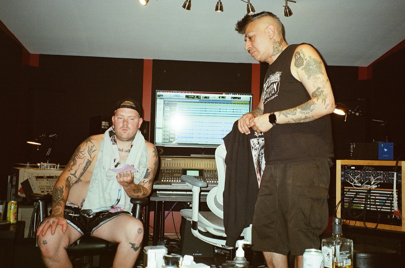 René and an artist in the control room during a recording session